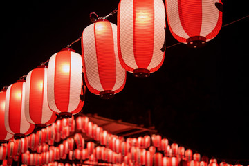 Illuminated Japanese red festival paper lanterns at night　夏祭りの赤い提灯 夜景
