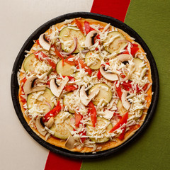 Raw pizza in a pan. Italian food cooking