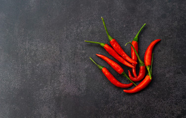red hot chili peppers on black wall background