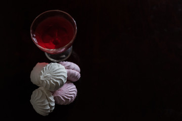 Zephyr and jelly isolated on a black background. Edible and calloric sweets