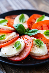 Caprese salad on wooden board

