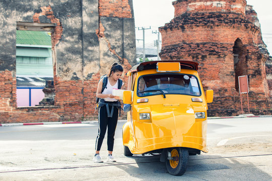 Traveler Japanese Girl Hollding Map Travel Query For The Way With Old Man Driver Taxi Or Tuk Tuk Touring.