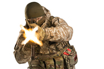 Soldier holding assault rifle and shooting. Uniform conforms to special services of the Russian...