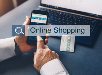 Woman's hands holding a credit card and using smartphone. Online shopping Concept