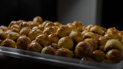 Nastar, an eid cookies with dark background and directional studio light
