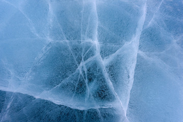 Beautiful ice of Lake Baikal with abstract cracks