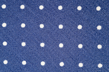 Stretch cotton dark blue in small white peas.