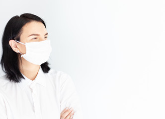 woman in medical mask on a white background