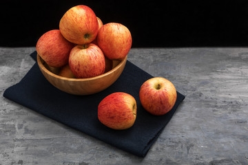Fototapeta na wymiar apples in a wooden bowl on top