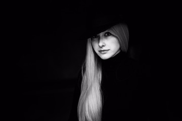 Psychology  dramatic photo of Woman on black background. 