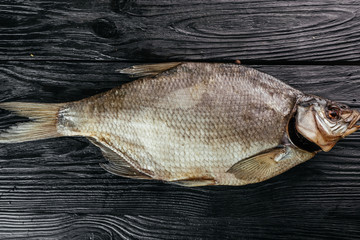 
fish on black wooden background