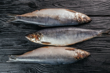 
fish on black wooden background