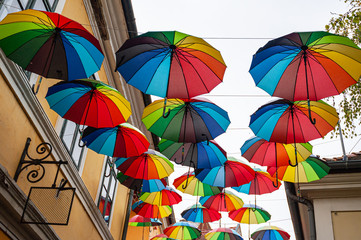 Obraz premium Street decorated with colored umbrellas.