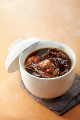 Delicious Chinese traditional stew, tea tree mushroom and chicken soup