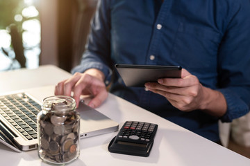 Businessman are calculating daily expenses in office.