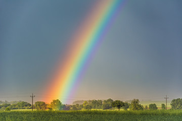 Naklejka na ściany i meble beautiful rainbow over the field