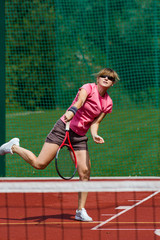 Female tennis player serving