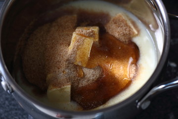 Adding golden syrup into pan with filling ingredients. Making Boston Banoffee Pie.