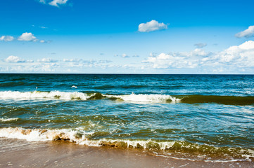 The Baltic Sea and blue sky with white clouds