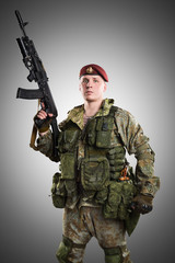 Male in russian mechanized infantry uniform isolated with clipping path on grey background.
