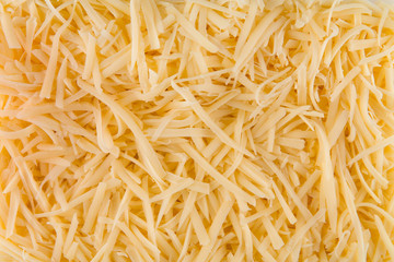 Closeup background texture grated cheese 