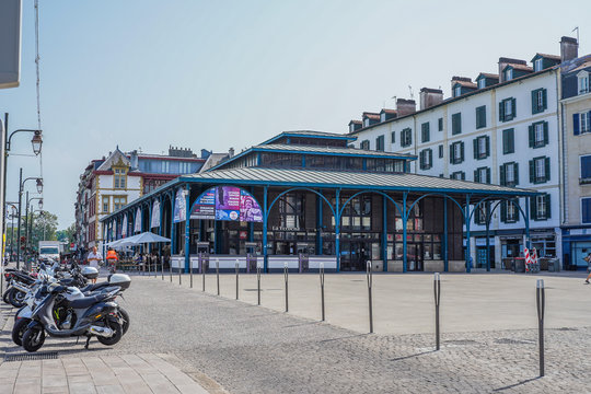 Street of Bayonne in France with buildings in the Nive River