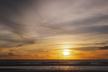 Fototapeta na wymiar Magical dramatic sunset on a tropical beach.
