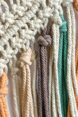Detail of a colorful macrame threads. Boho style.