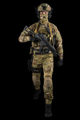 Soldier holding assault rifle. Uniform conforms to special services of the Russian Federation. Shot in studio. Isolated with clipping path on black background