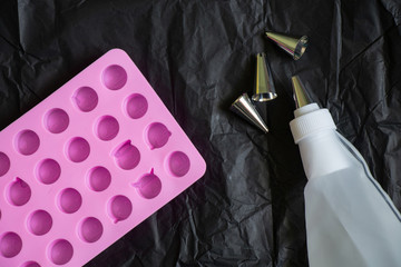 pastry bag and nozzles on the kitchen on the table, pastry set