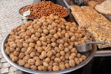 Nuts on a large platter on sale. Market for Eastern sweets. variety of nut varieties on the market