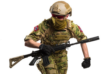 Marinejegerkommandoen (Norwegian Special Operation forces) soldier with rifle on white background. Shot in studio. Isolated with clipping path.
