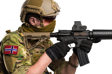 Marinejegerkommandoen (Norwegian Special Operation forces) soldier with rifle on white background. Shot in studio. Isolated with clipping path.
