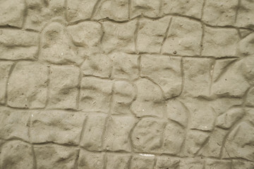Stone wall texture. Asymmetric bricks. Concreted wall background 