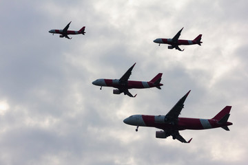 Silhouette plane group flying in cloud of the clouds in background