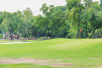 sand mound in golf course with lush grass, are perfect for doing sports during the day