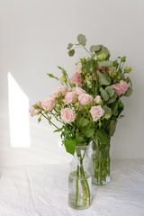 Flowers in a glass vase on the table