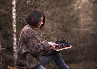 young woman with a burned book