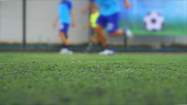 Surface Level Shot Of People Playing Soccer On Field