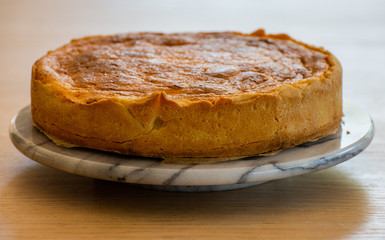 
traditional belgian cheesecake on a marble cake plate
