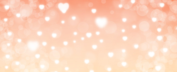 Obraz na płótnie Canvas Glowing soft orange bokeh background. Spring concept. Blurred bokeh circles and hearth shapes. Website banner. Celebration. Christmas.