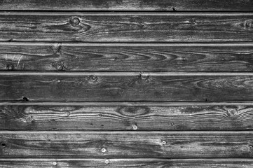 wooden boards background. aged burned black wooden planks. toned black white color