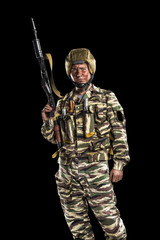 Fototapeta premium Male in uniform conforms to Russian army special forces (OMON)&nbsp;in War in Chechnya. Isolated on black backgroundx