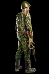 Male in uniform conforms to Russian army special forces (OMON) in War in Chechnya. Isolated on black backgroundx