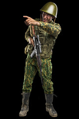 Male in uniform conforms to Russian army special forces (OMON) in War in Chechnya. Isolated on black backgroundx