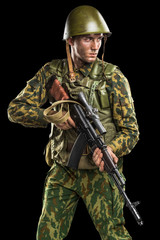 Male in uniform conforms to Russian army special forces (OMON) in War in Chechnya. Isolated on black backgroundx