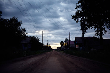 Fototapeta na wymiar Close-up of the street and evening sunset