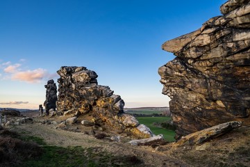 Sunset at Teufelsmauer near Weddersleben, Thale, National Park Harz, Germany. Colorful winter evening light with blue sky. Natural idyllic landscape view. 
