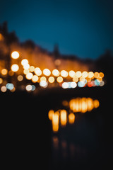 Blurry city lights in Prague. Nightlife in the old city center.