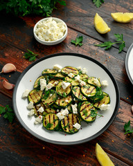 Warm salad with grilled zucchini, garlic and herbs